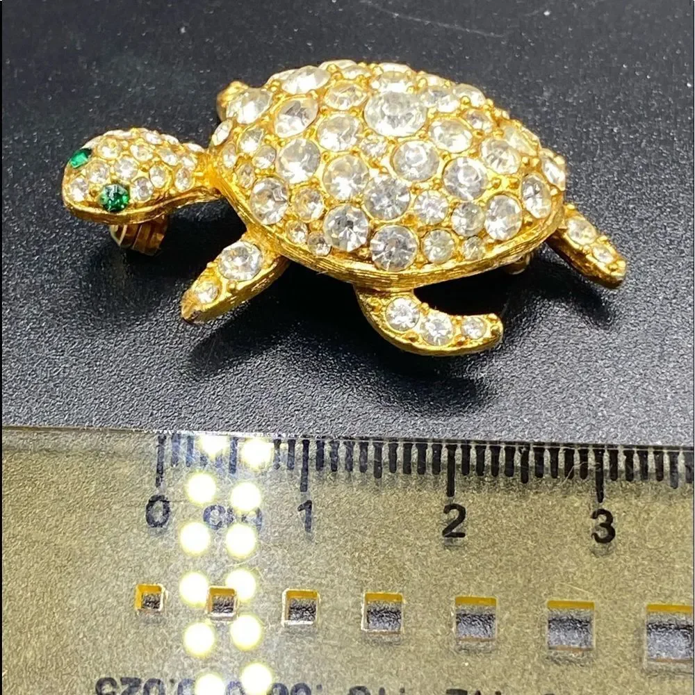 Gold tone rhinestone turtle tortoise pin brooch with green glass eyes gorgeous
